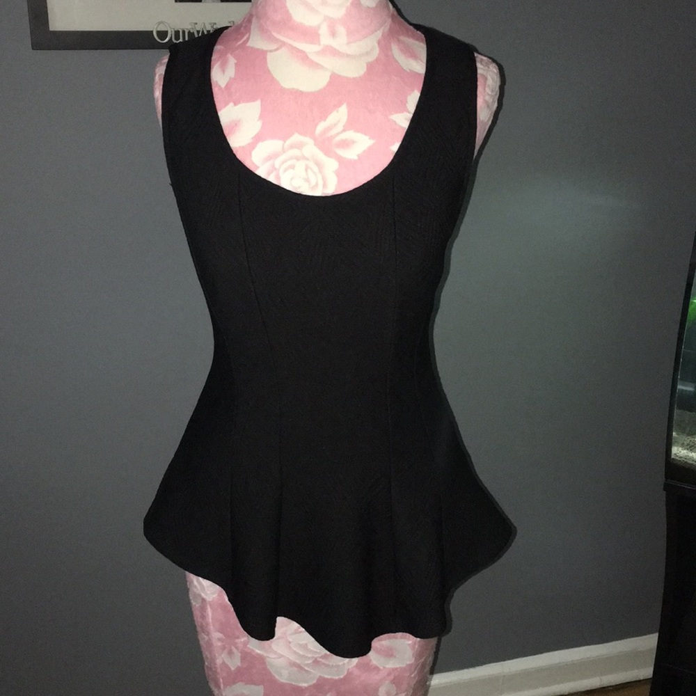 Black peplum top never worn